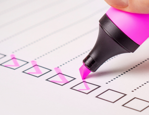 a check list for documents with a pink highlighter