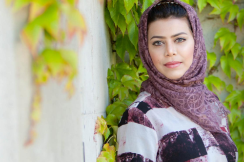student_testimonial_image a woman from Saudi Arabia smiling at the camera
