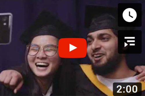 youtube_video_image two students smiling each other in the graduation attire